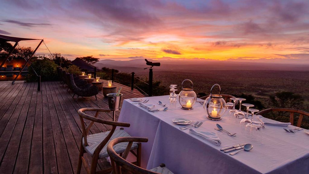 Elewana Loisaba Tented Camp accommodation romantic dinner by main areas deck Louise and Scott at Hays Travel